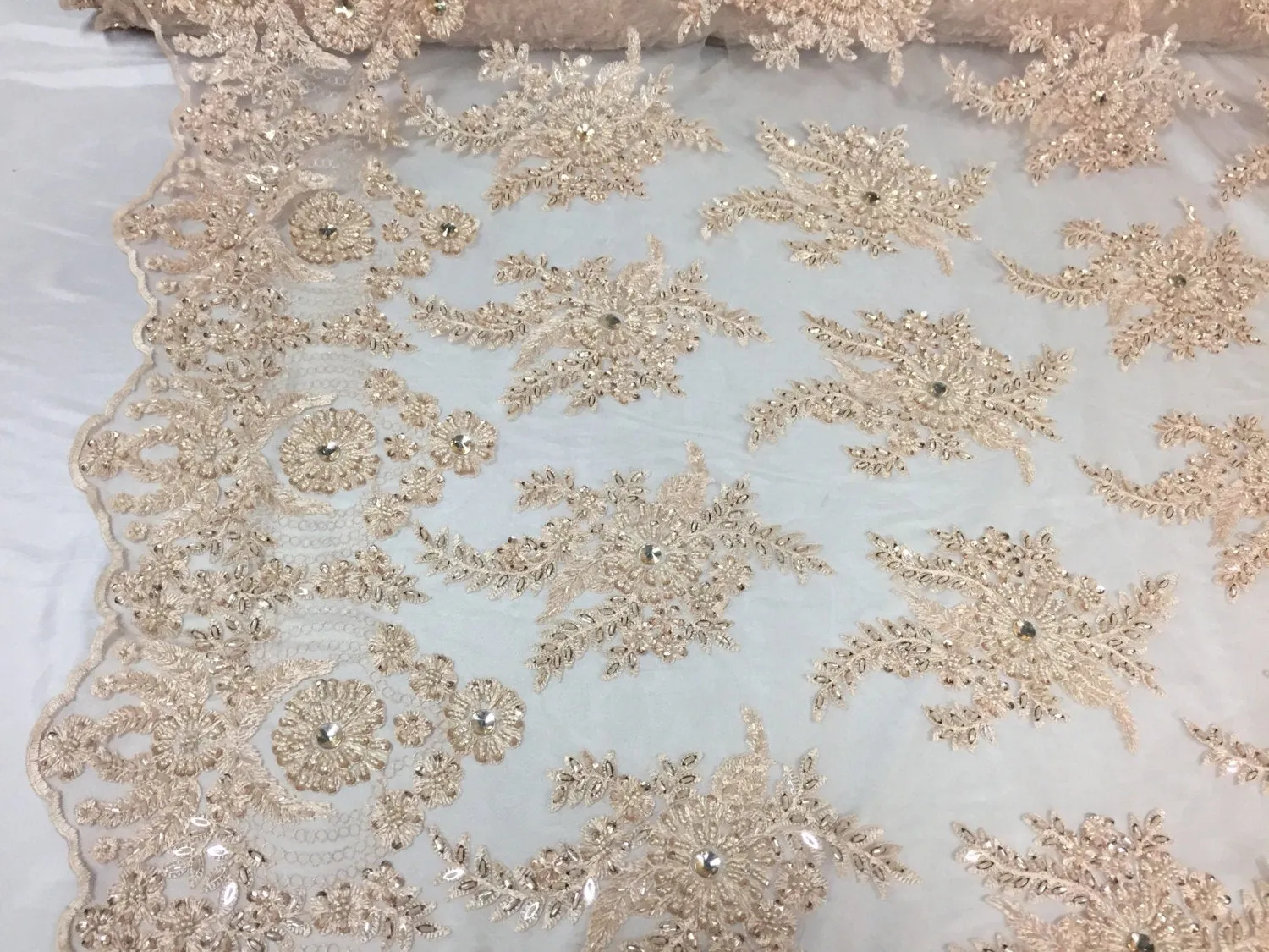 Skin imperial design embroider and beaded on a mesh lace -Sold by the yard