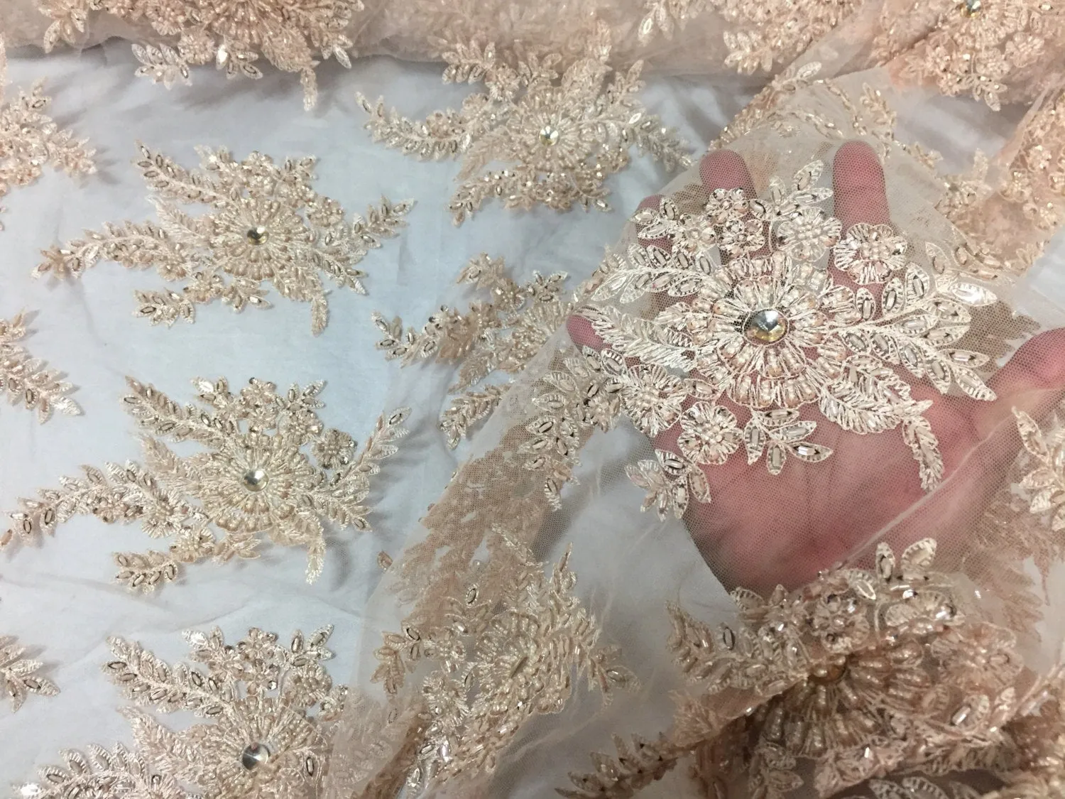 Skin imperial design embroider and beaded on a mesh lace -Sold by the yard