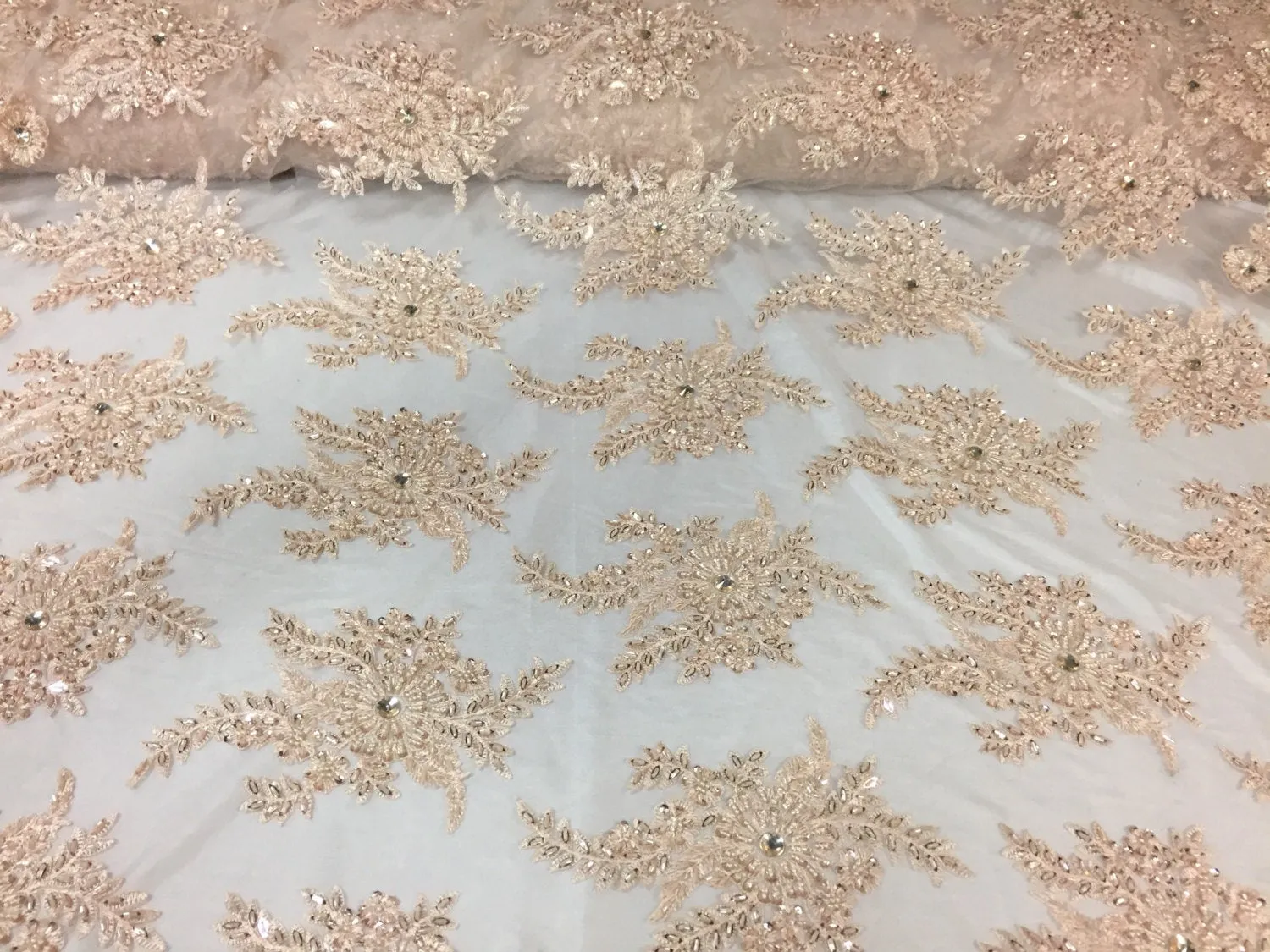 Skin imperial design embroider and beaded on a mesh lace -Sold by the yard